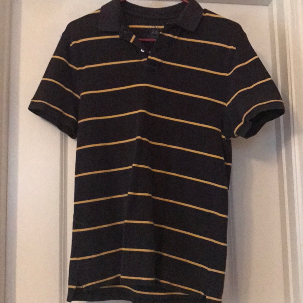 Black polo with gold stripes